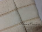 1 - coppia asciugamani  in  spugna beige con bordo lino avorio